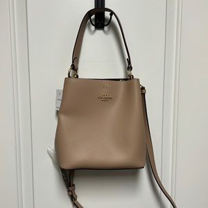 New with tags Coach small bucket purse.